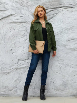Olive green corduroy button-up jacket with two chest pockets and a collared neckline.