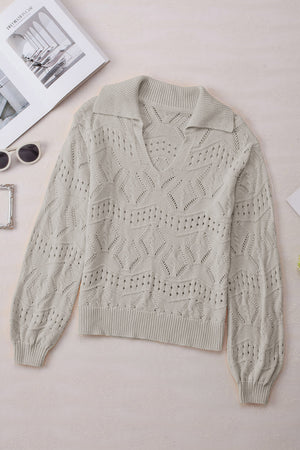 Gray openwork collar knit sweater with V-neck and long sleeves.