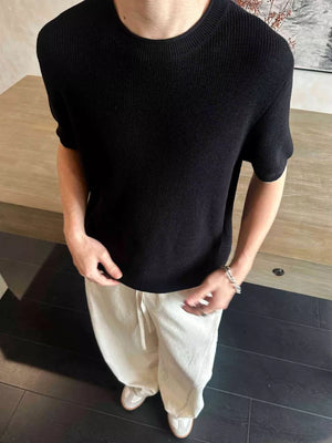 Black short sleeve knit undershirt with crew neck.