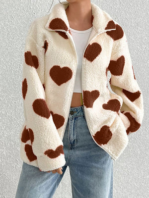 Heart print sherpa zip-up jacket with a spread collar and full zip closure.