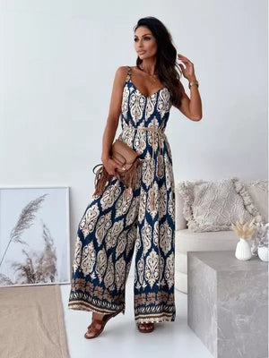 Peacock blue paisley wide-leg romper with tie belt and v-neck.