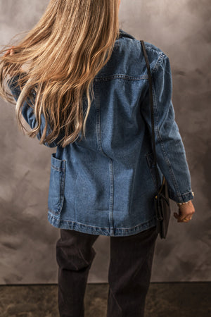 Medium wash denim blazer with patch pockets and a double-breasted cut.