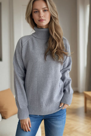 Gray speckled Donegal turtleneck sweater with ribbed cuffs and hem.