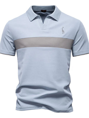 Light blue polo shirt with grey stripe and giraffe embroidery