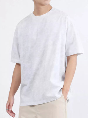 Men's relaxed fit t-shirt in white cotton blend with a subtle textured pattern.