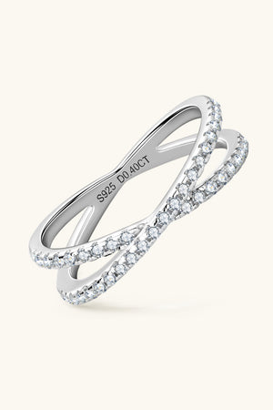 Silver pavé crossover band ring with cubic zirconia accents.