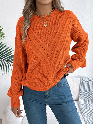Orange chevron knit sweater with eyelet detail and crew neck.