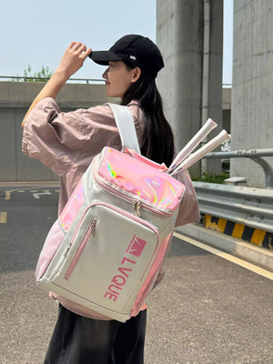 Iridescent accent waterproof sports backpack in pink and purple with tennis rackets.