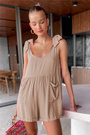 Camel romper with bow shoulders, gathered waist, and pockets