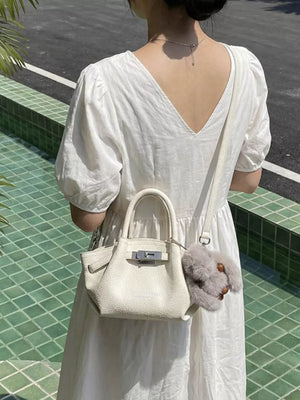 Top Handle Leather Crossbody Bag in Black, model styling view