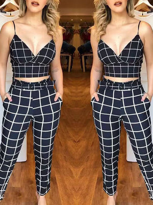 Chic black and white grid print two-piece set with a cropped cami and belted pants.