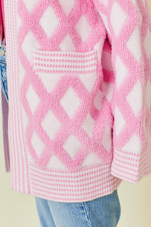 Diamond jacquard knit open cardigan in blush pink with a textured diamond pattern and a pocket detail.