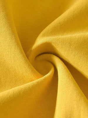 Yellow men's undershirt fabric detail with textured weave