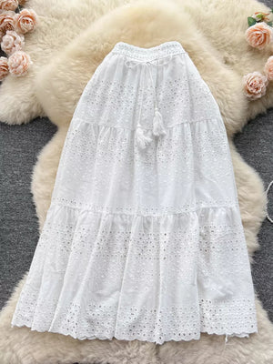 White eyelet tiered maxi skirt with tassel drawstring waist