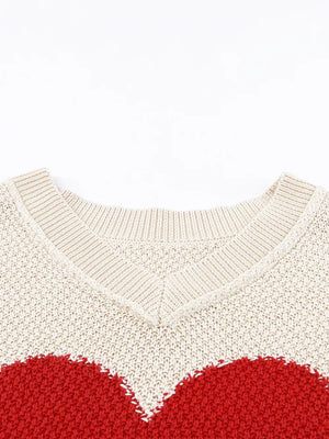 Beige v-neck knit sweater with a red heart pattern, cotton blend.
