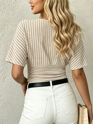 Chic striped t-shirt with smocked waist and batwing sleeves in beige and white.