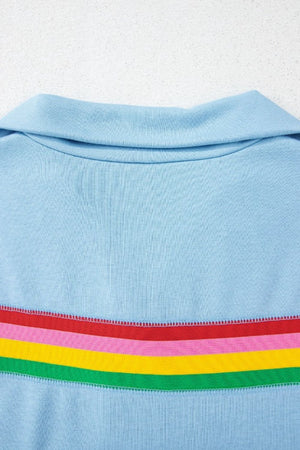 Light blue activewear shorts with rainbow stripe detail and collar
