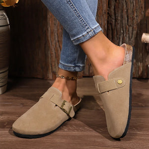 Suede buckle mules in mocha with cork sole detail and adjustable strap.