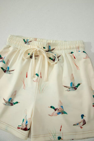 Beige pajama shorts with mallard duck print and drawstring waist.