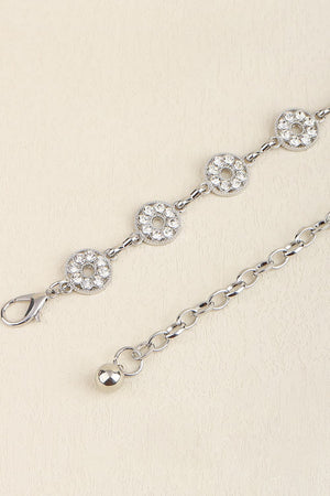 Silver chainmail belt with circular rhinestone accents and a lobster clasp closure.