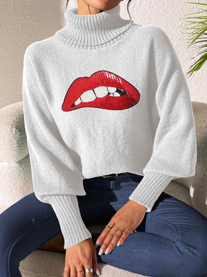 White turtleneck sweater with sequin red lips detail and balloon sleeves.