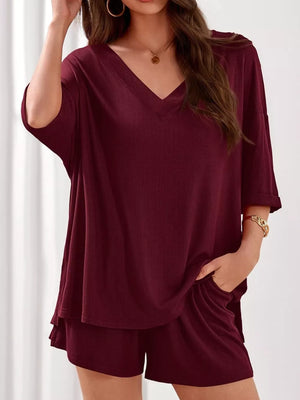 Burgundy ribbed V-neck loungewear set with relaxed fit top and shorts.