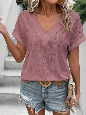 Pink purple eyelet v-neck tunic top with short sleeves and a textured pattern.