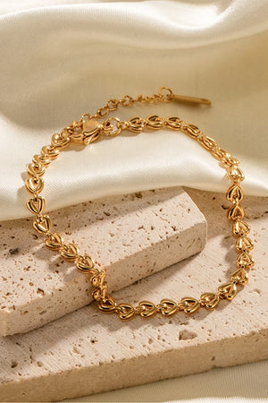 Gold linked heartbeat chain bracelet with adjustable clasp