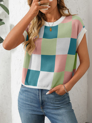 Checkerboard knit cap sleeve top in pastel pink, green, blue, and white.