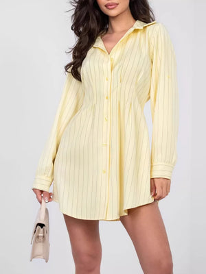 Light yellow pinstripe mini shirt dress with button detail and collared neckline.