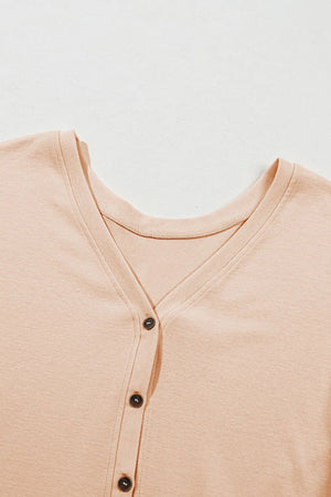 Peplum button-down v-neck top in Dust Storm cotton with dark buttons.