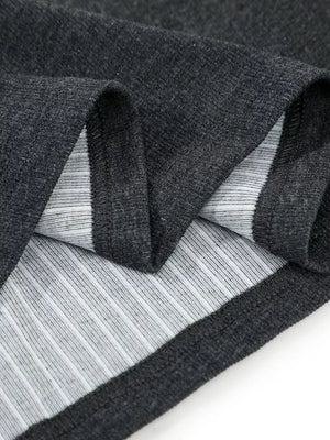 Textured ribbed henley t-shirt in dark gray, showing fabric detail and contrast lining.