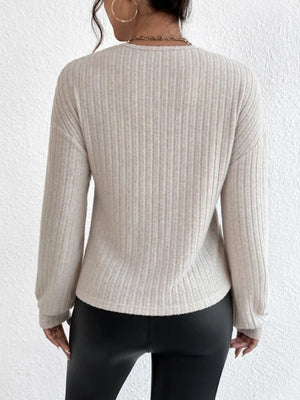 Dust Storm ribbed knit top with blouson sleeves and a cross-front detail.