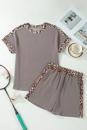 Brown ribbed knit two-piece set with leopard trim on neckline, sleeves, and shorts.
