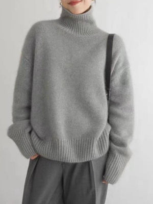 Relaxed fit gray cashmere turtleneck sweater with ribbed cuffs and hem.