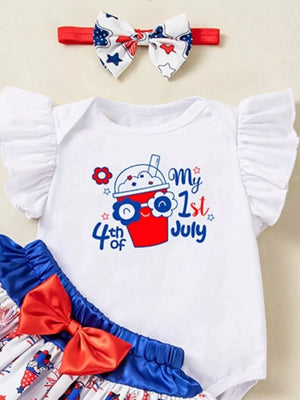 White baby outfit with ruffled sleeves, "My 1st 4th of July" graphic, and matching patriotic headband.