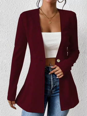 Wine red single-button blazer with tailored fit and long sleeves, styled open over a white top.