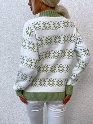 White and green fair isle mock neck pullover sweater with snowflake pattern.