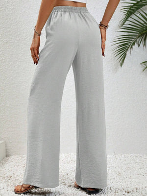 Light Gray textured palazzo trousers with drawstring waist and wide legs.