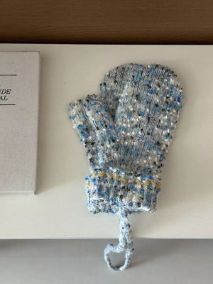 Light blue textured knit mittens with zig-zag detail and hanging loop