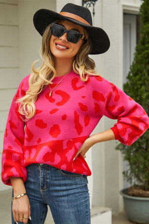 Colorblock leopard knit sweater with balloon sleeves in hot pink and red.