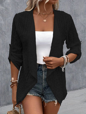 Black open-weave draped front cardigan with rolled sleeves and open front.
