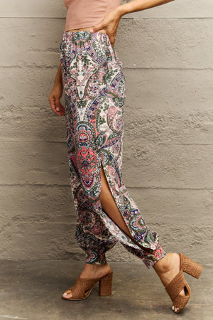 Paisley print joggers in multicolor with high slit legs and elastic cuffs.