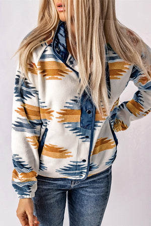 Navajo fleece snap-front jacket in multicolor with blue snap details and pockets.
