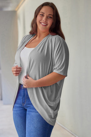 Light gray ribbed batwing cardigan with drape front, styled with a white tank and jeans.