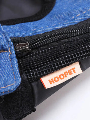 Denim-like pet carrier backpack detail with mesh panel and zipper.