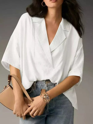 White V-neck half sleeve shirt with a relaxed fit and textured fabric.