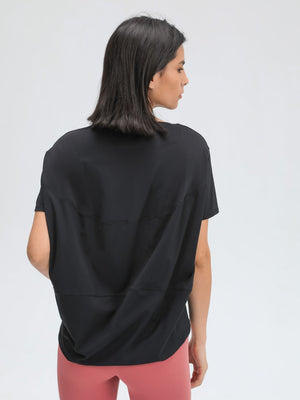 Black relaxed fit performance tee with short sleeves and a crew neck.