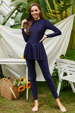 Navy blue long sleeve swimsuit with flounce hem and leggings
