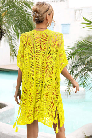 Yellow open-knit caftan with side tie detail and tassels, acrylic material.